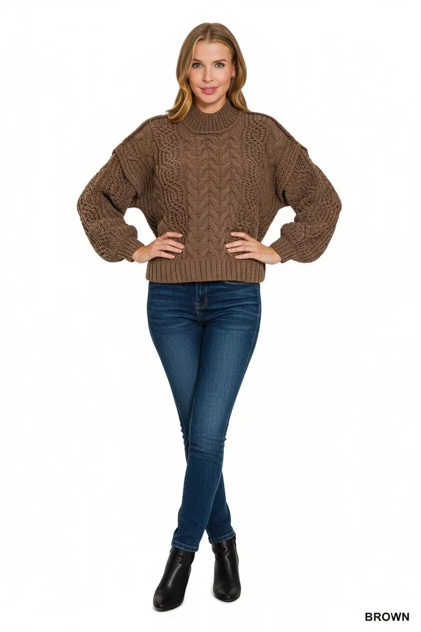 Women’s cozy brown cable-knit sweater with ribbed mock neck and relaxed fit, perfect for winter layering and casual outfits.