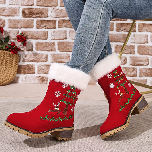 Red suede Christmas boots with faux-fur cuffs, embroidered reindeer, Christmas trees, holly, and snowflakes.