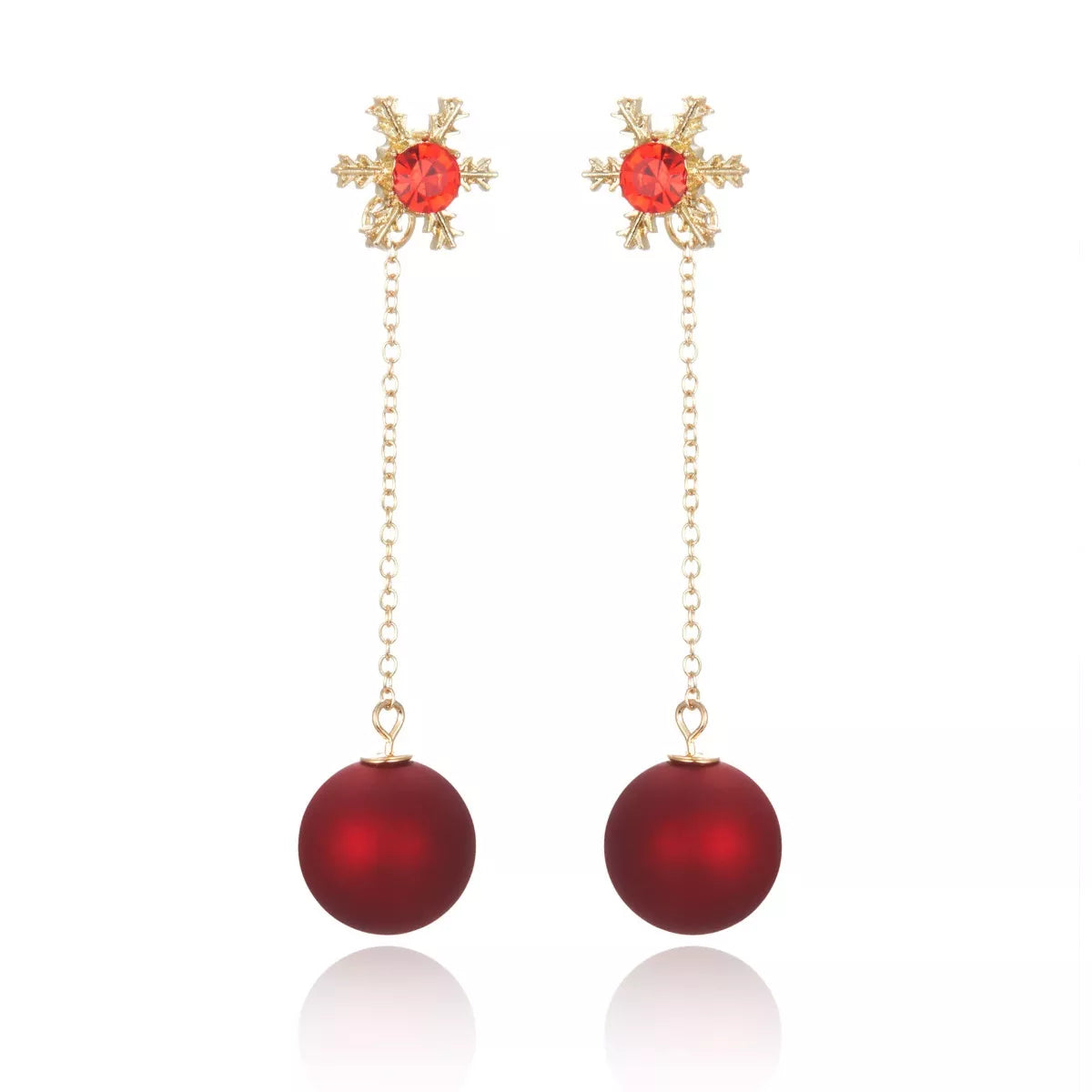 Festive red bauble drop earrings with snowflake studs and gold chain detailing.
