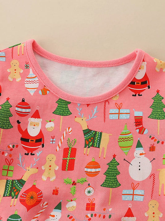 Pink Christmas-themed kids dress with Santa, reindeer, snowmen, gifts, gingerbread men, and ornaments printed all over.