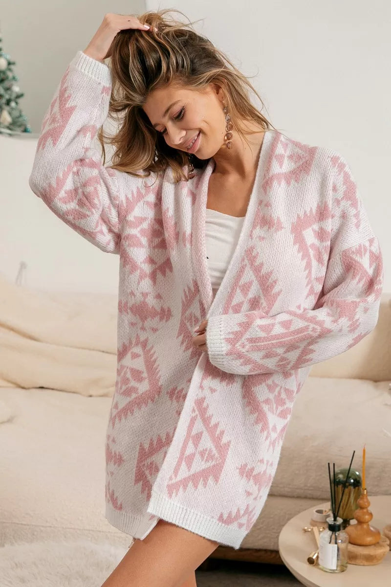 Model wearing Blush Horizons Cardigan in soft pink with Aztec pattern and open front design