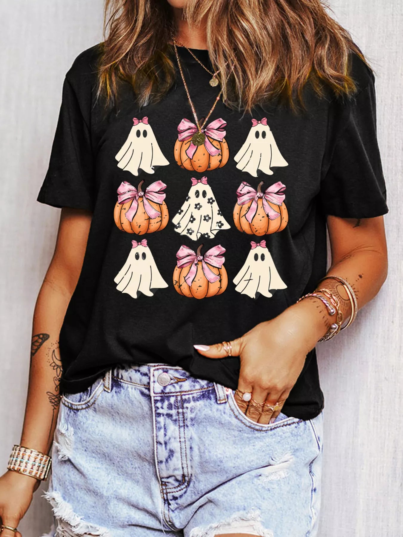 Black Halloween tee with ghosts and pumpkins wearing pink bows – Boo Crew Bowknot style from A Whimsical Affair.