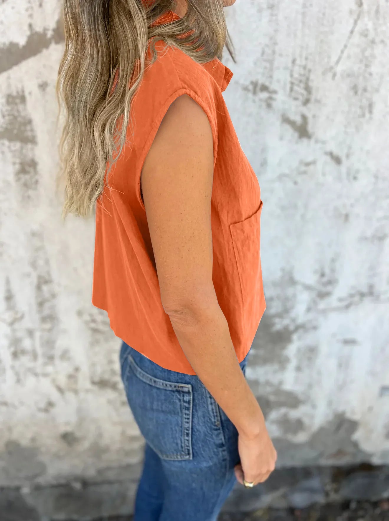 Breezy Linen Cap Sleeve Shirt in orange with button-down front, cap sleeves, and pockets.