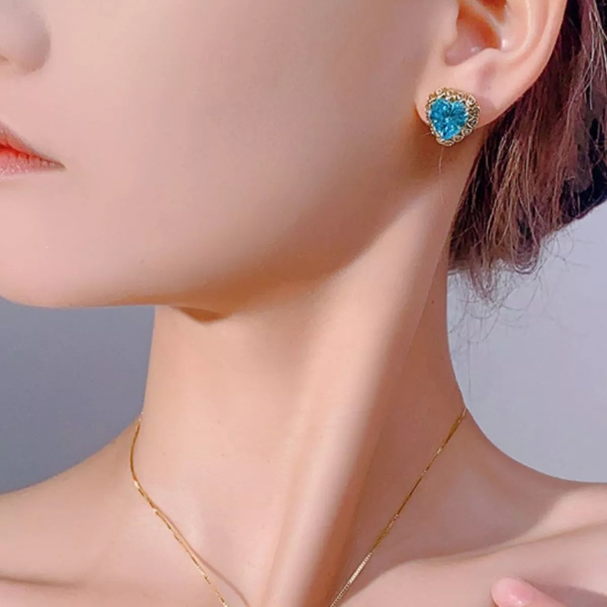 Heart-shaped blue zircon earrings with gold-plated setting and halo stones