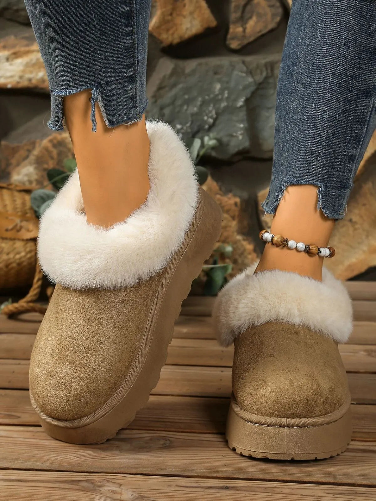 Woman wearing tan faux fur-lined winter slippers with platform soles — cozy cold-weather footwear from A Whimsical Affair.