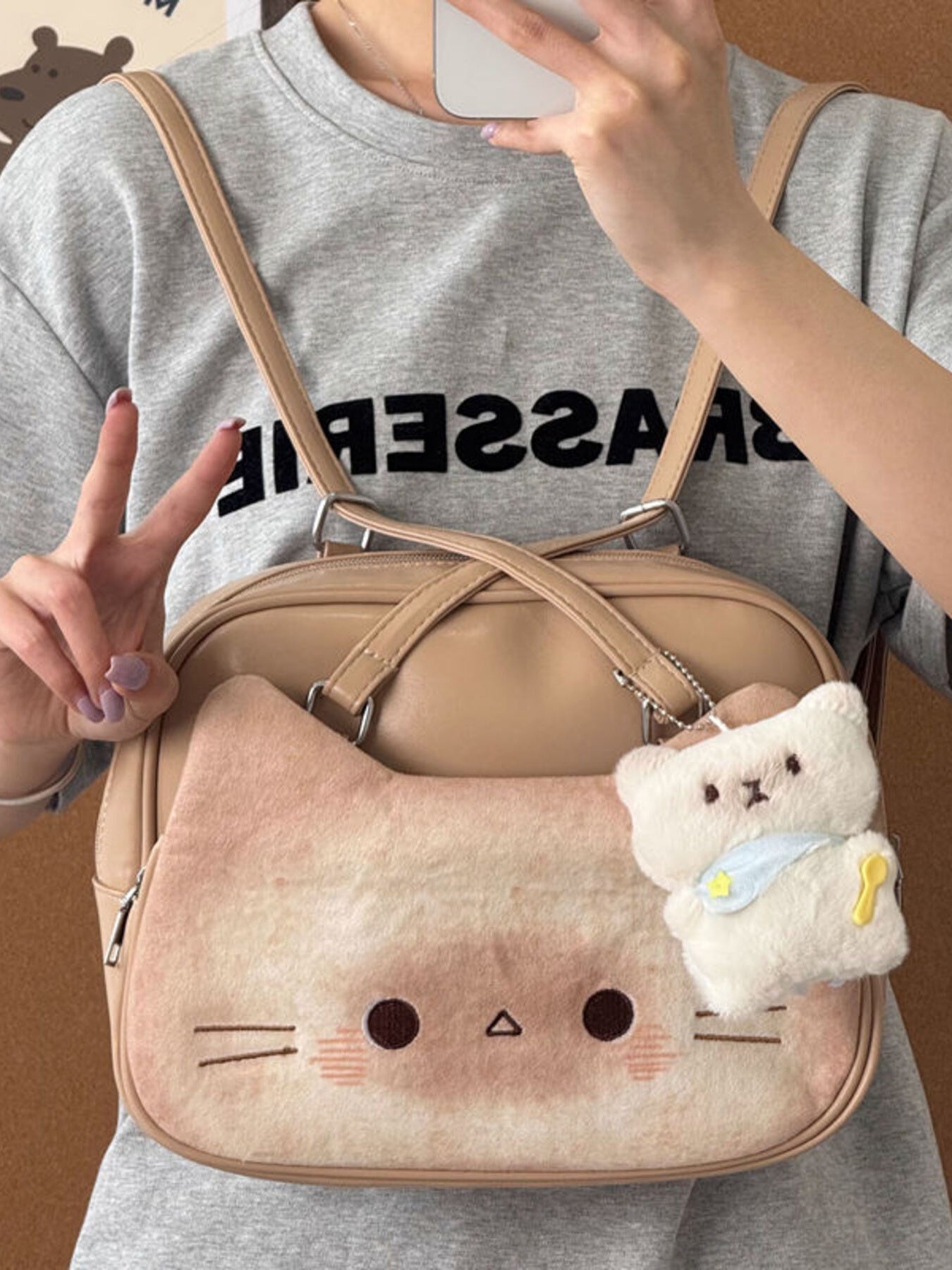 Medium beige shoulder bag with plush cat face and bear charm