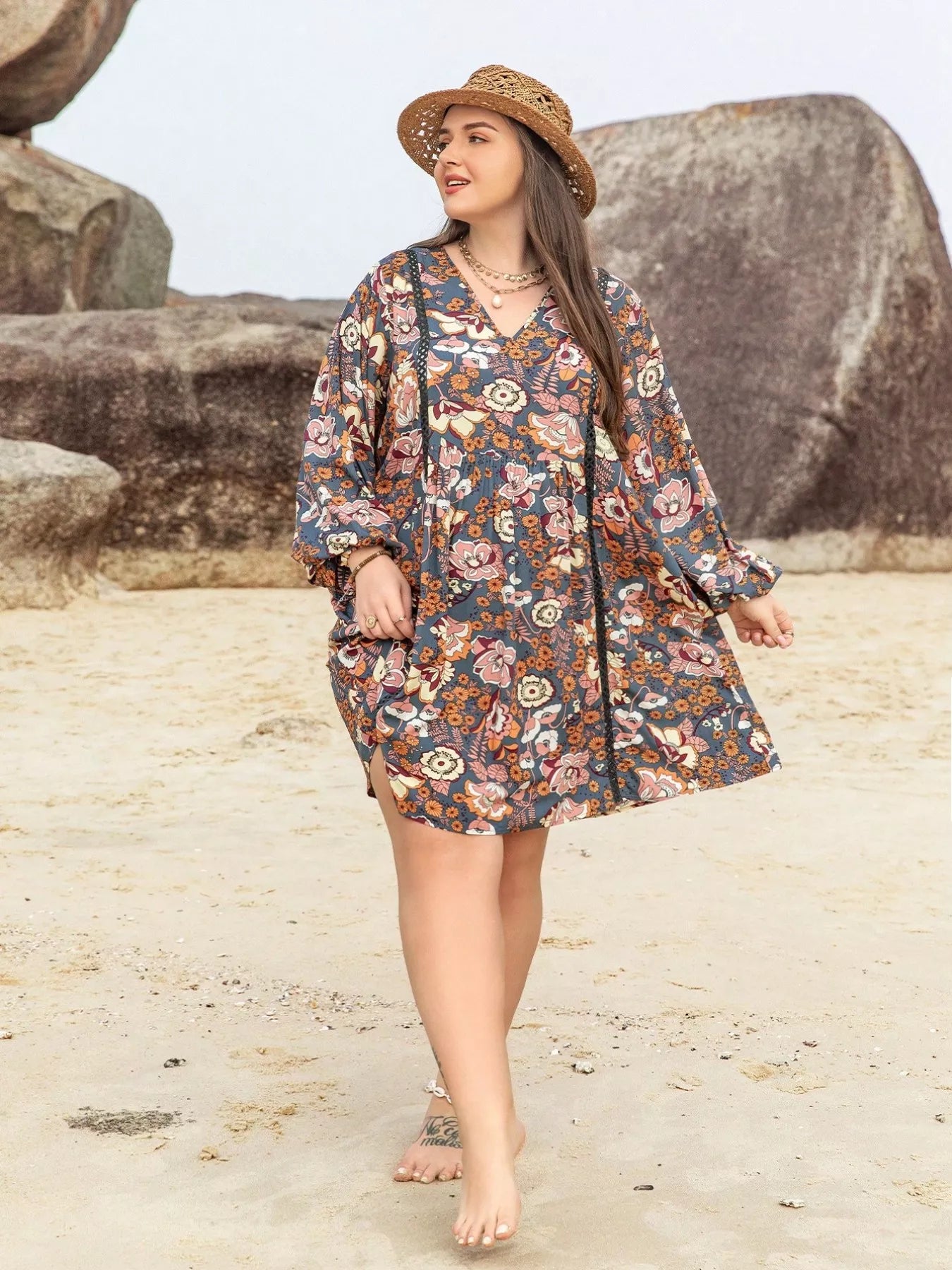Boho floral mini dress with long sleeves, ruched waist, and flowy fit in multicolor print