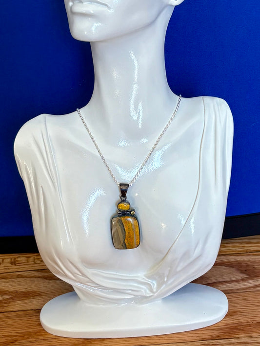 Sterling silver bumble bee jasper pendant featuring natural golden yellow and gray banded stone.