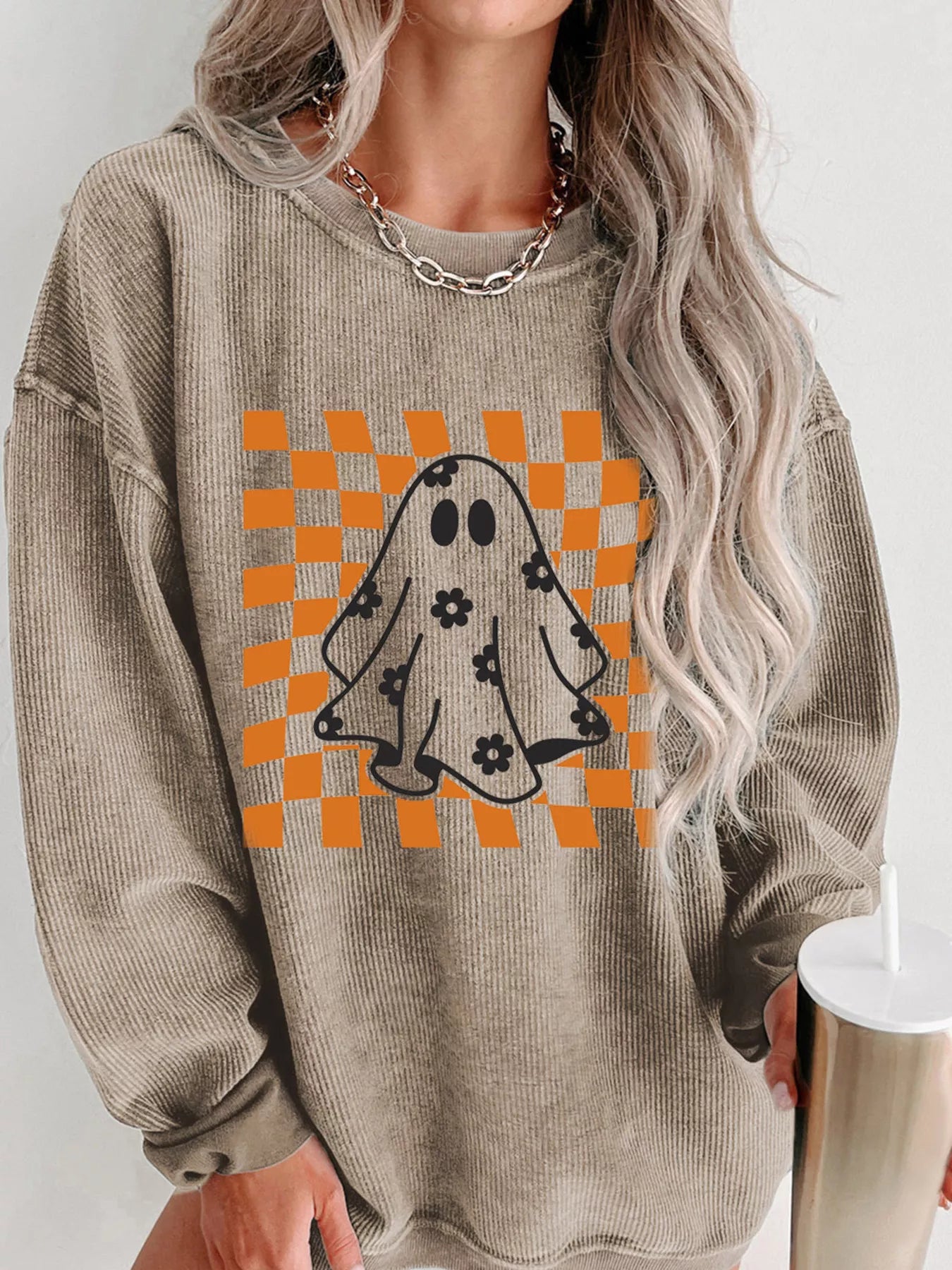 Oversized corded sweatshirt with ghost graphic on retro orange checkerboard with floral accents – Groovy Ghost style from A Whimsical Affair.