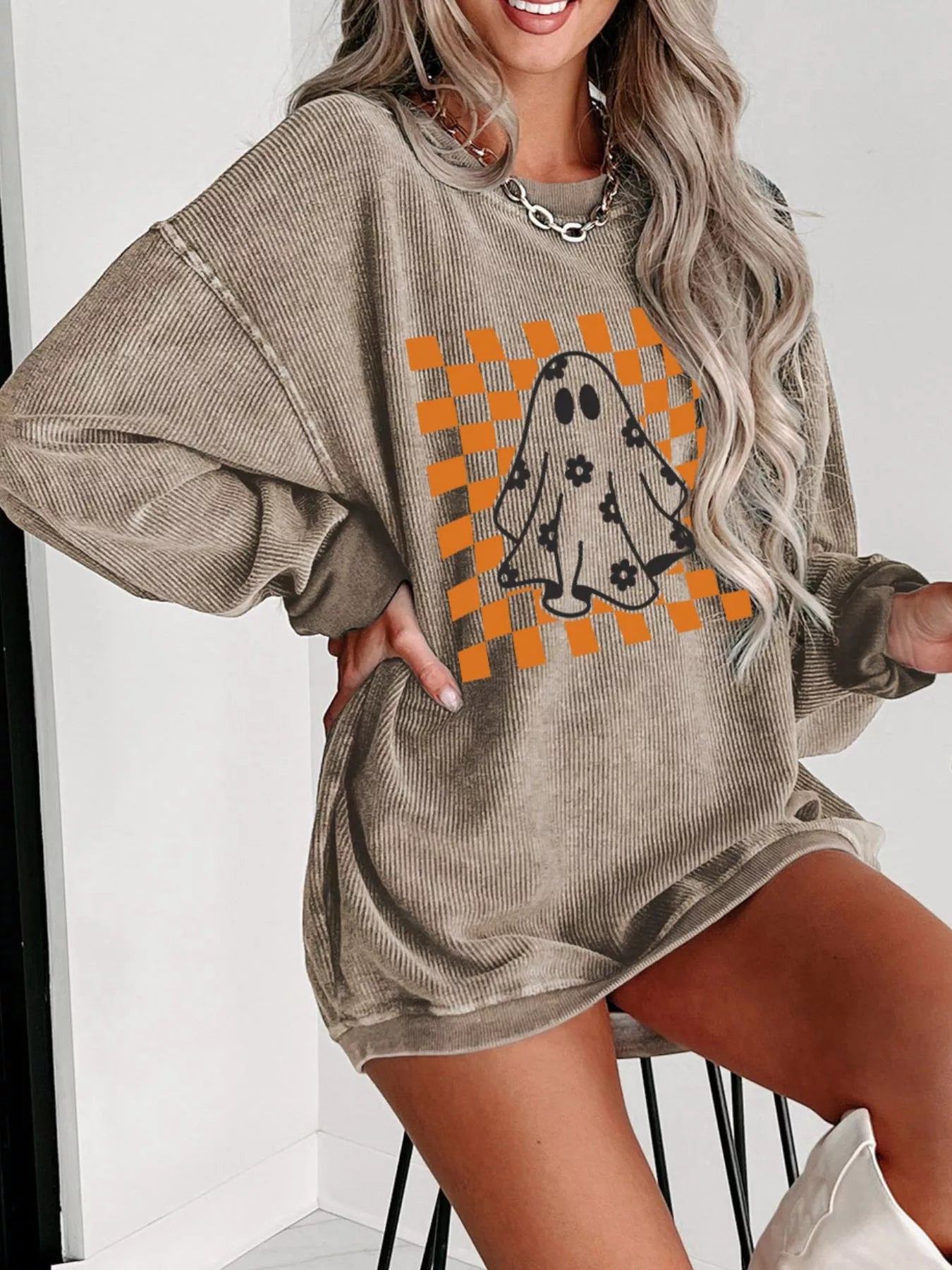 Oversized corded sweatshirt with ghost graphic on retro orange checkerboard with floral accents – Groovy Ghost style from A Whimsical Affair.