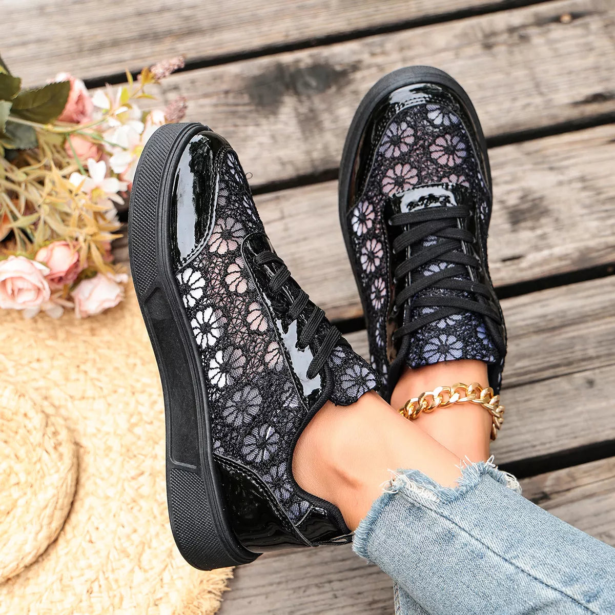 Floral lace mesh sneaker flats with lace-up design, flat heel, rubber sole, and casual everyday styling shown in black and white.