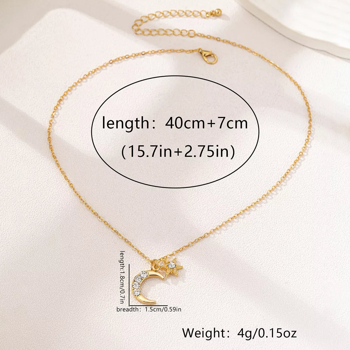 Gold layered necklace featuring star and crescent moon pendants, celestial 18K gold-plated jewelry