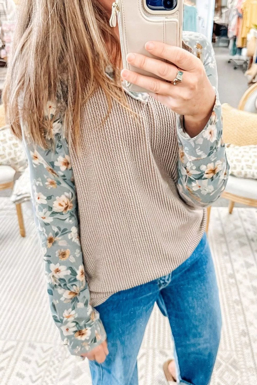 Ribbed knit top with floral long sleeves styled casually with jeans for everyday wear