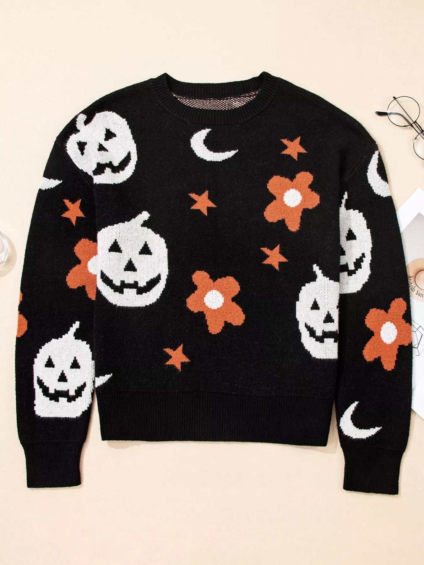 Black Halloween sweater with jack-o’-lanterns, moons, stars, and flowers – Midnight Magic style from A Whimsical Affair.