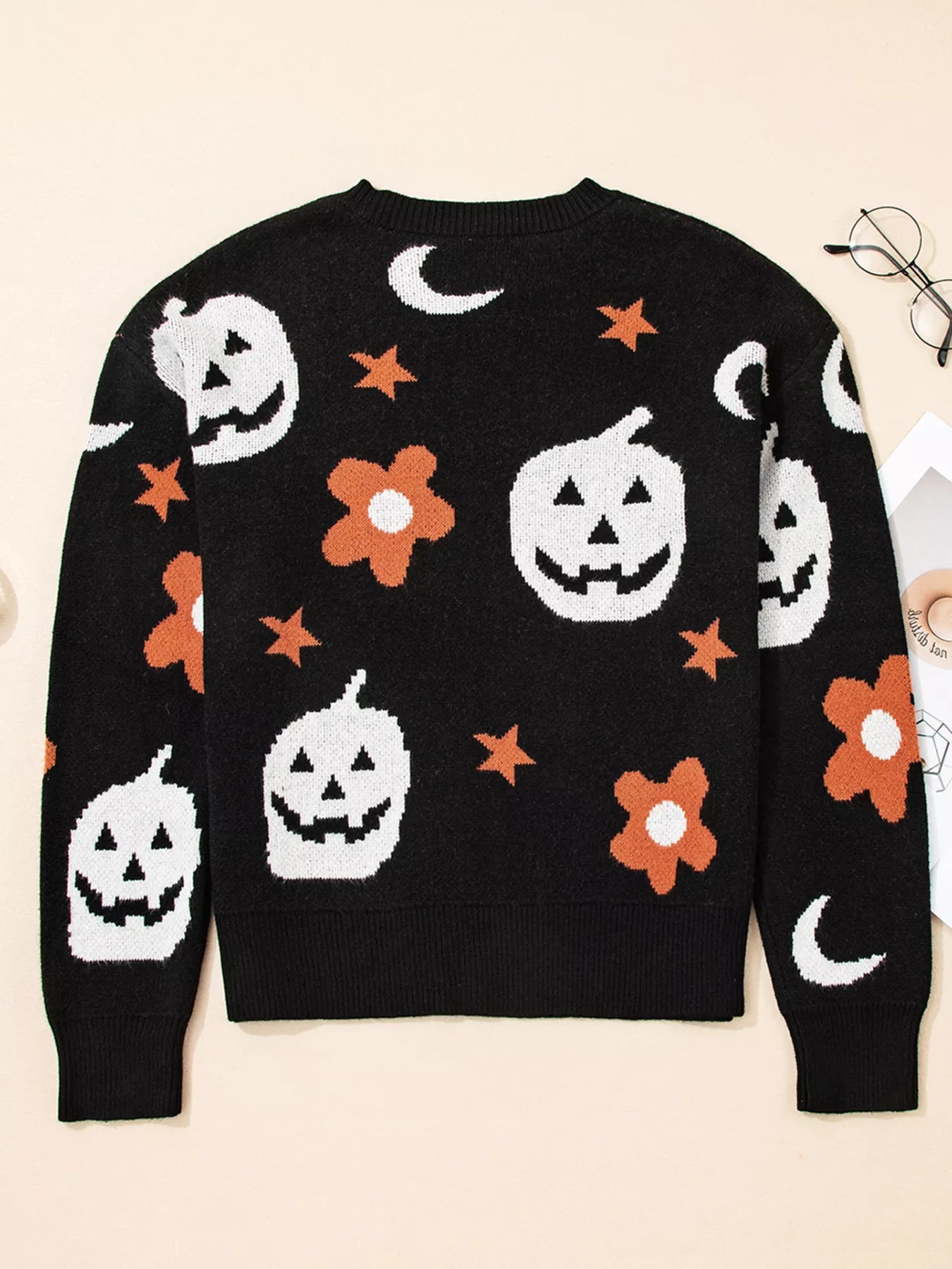 Black Halloween sweater with jack-o’-lanterns, moons, stars, and flowers – Midnight Magic style from A Whimsical Affair.