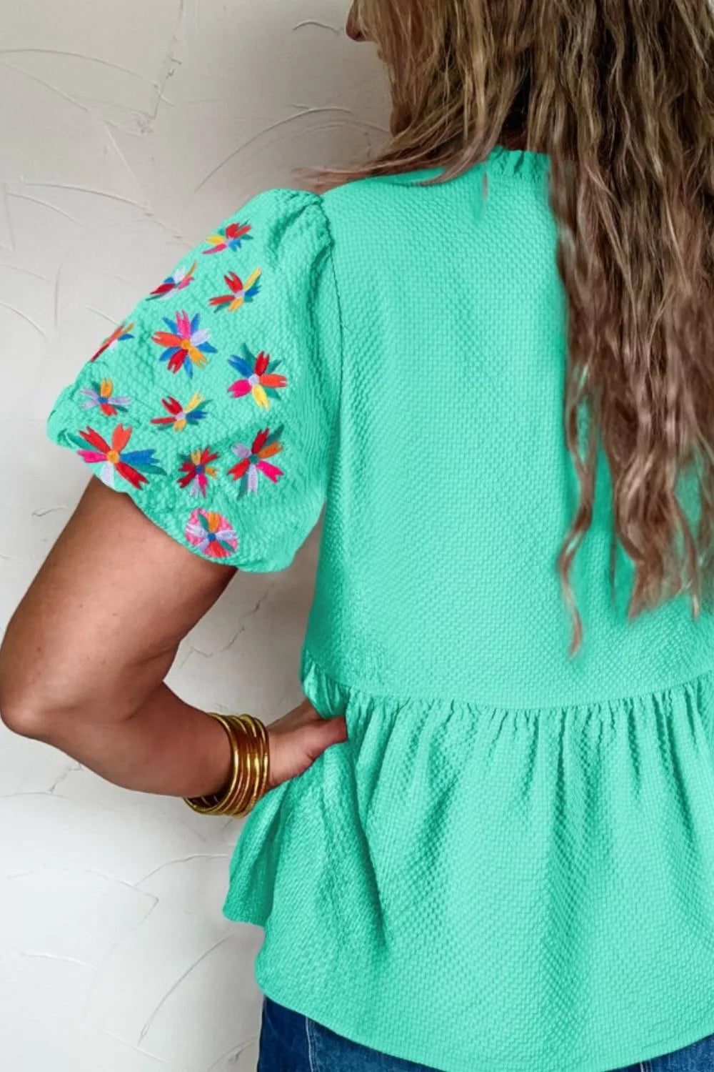 Mint textured peplum top with embroidered puff sleeves
