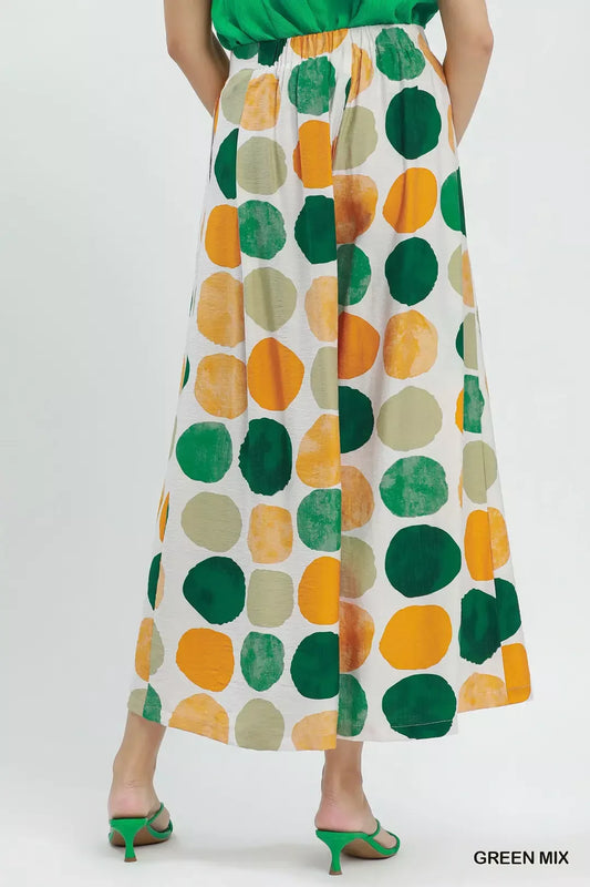 Colorful dot print wide-leg pants with pockets, a relaxed fit, and a flowy lightweight silhouette.