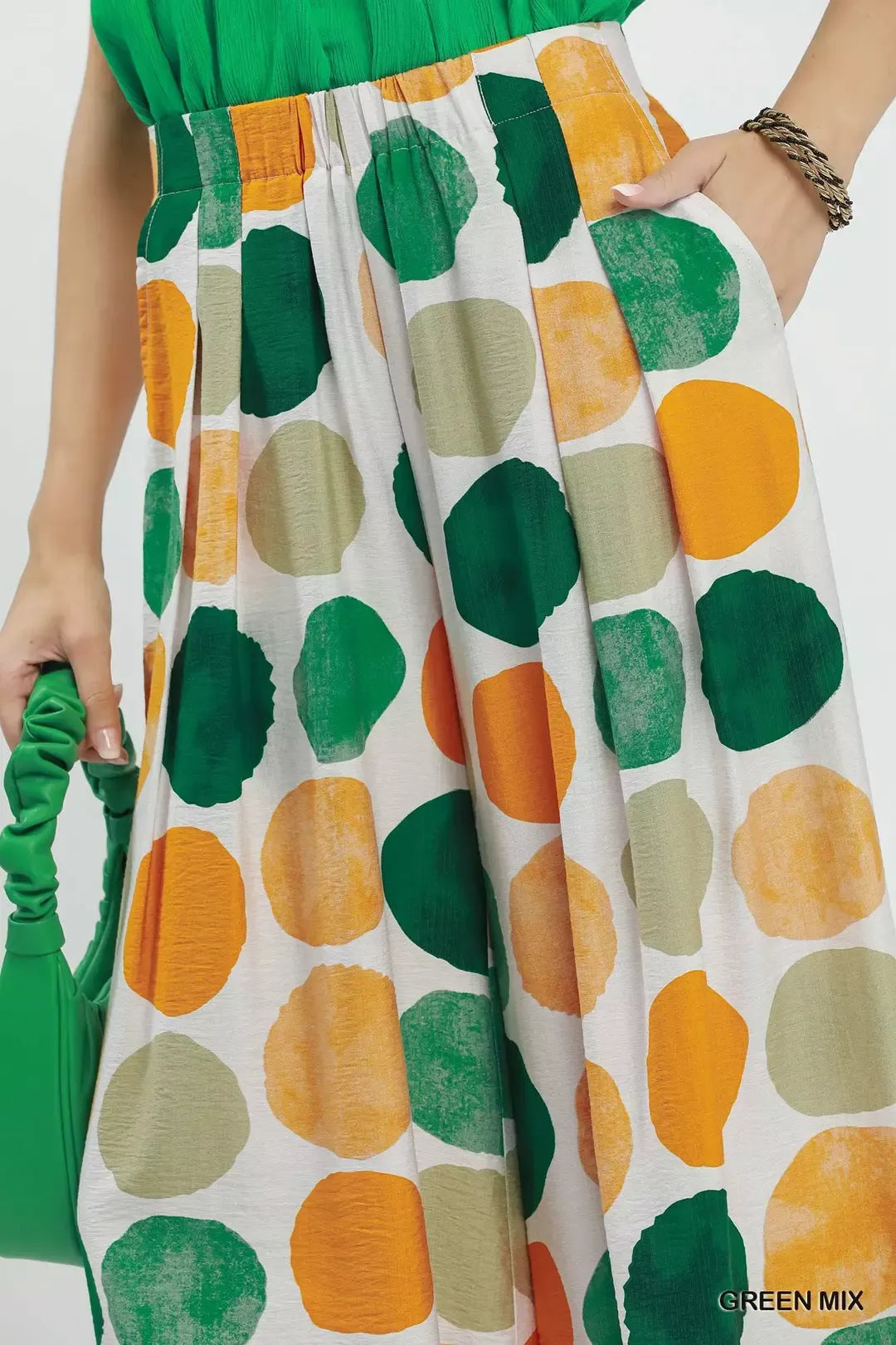 Colorful dot print wide-leg pants with pockets, a relaxed fit, and a flowy lightweight silhouette.