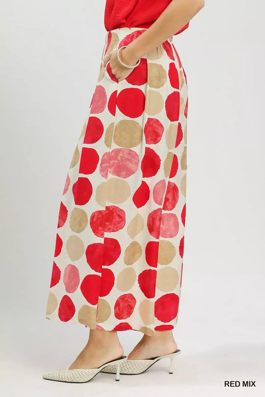 Colorful dot print wide-leg pants with pockets, a relaxed fit, and a flowy lightweight silhouette.