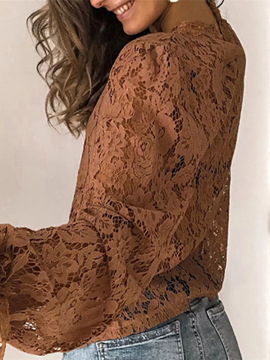 Brown floral lace long sleeve blouse with round neck and elegant detailing.