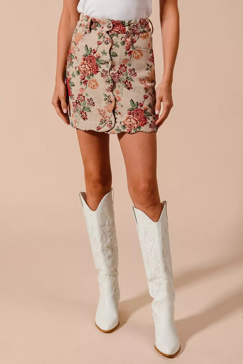 Rosette Charm Jacquard Mini Skirt – floral jacquard fabric with button front and scalloped hem.