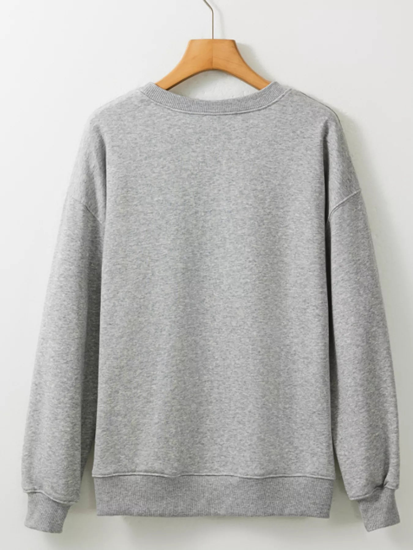 Gray sweatshirt with ghost in orange beanie holding coffee and jack-o’-lantern, surrounded by bats – Sippin’ Spooky style from A Whimsical Affair.