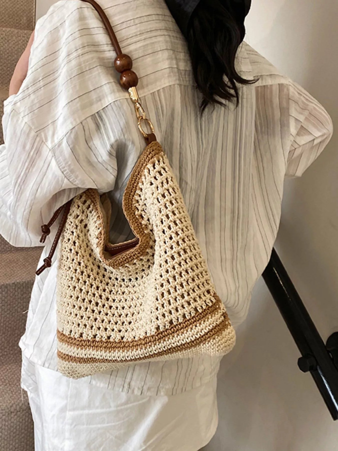 Medium woven boho shoulder bag with crochet-style texture, beaded accents, brown strap details, and lightweight polyester material.