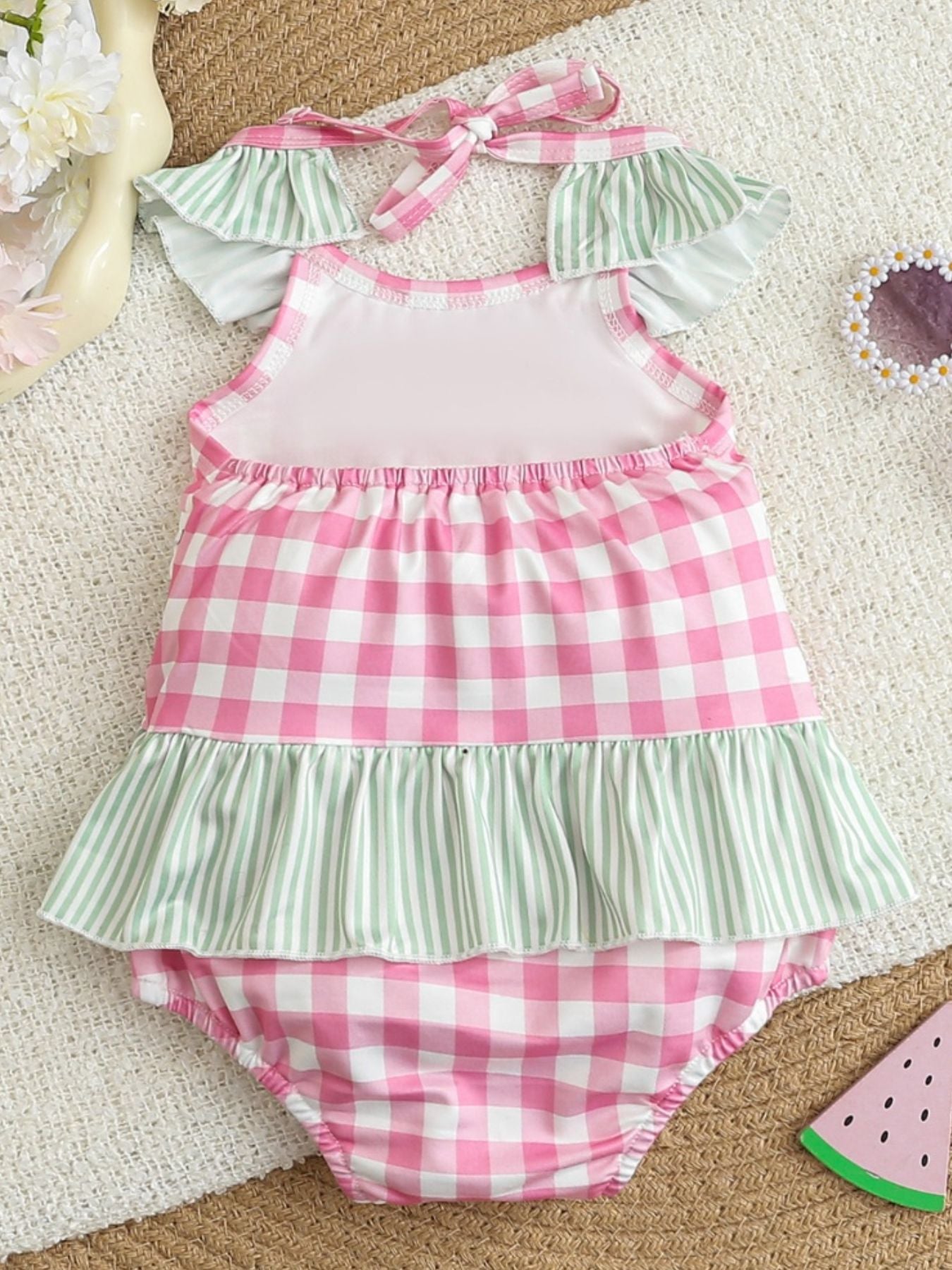 Baby romper with smocked fruit embroidery and gingham pattern