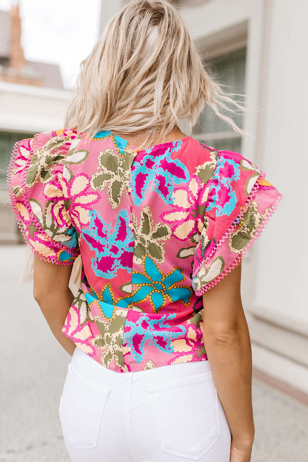 Colorful floral flutter sleeve boutique blouse with stretchy fit
