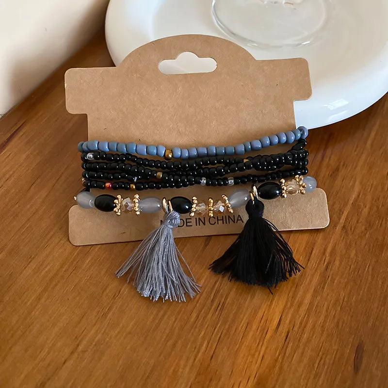 Black rice bead bracelet with tassel accent – Whisper style from A Whimsical Affair.