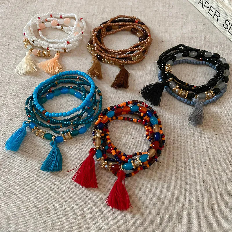 Rice bead bracelet with tassel accent, available in multiple colors – Whisper style from A Whimsical Affair.