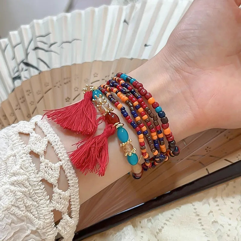 Deep red rice bead bracelet with tassel accent – Whisper style from A Whimsical Affair.