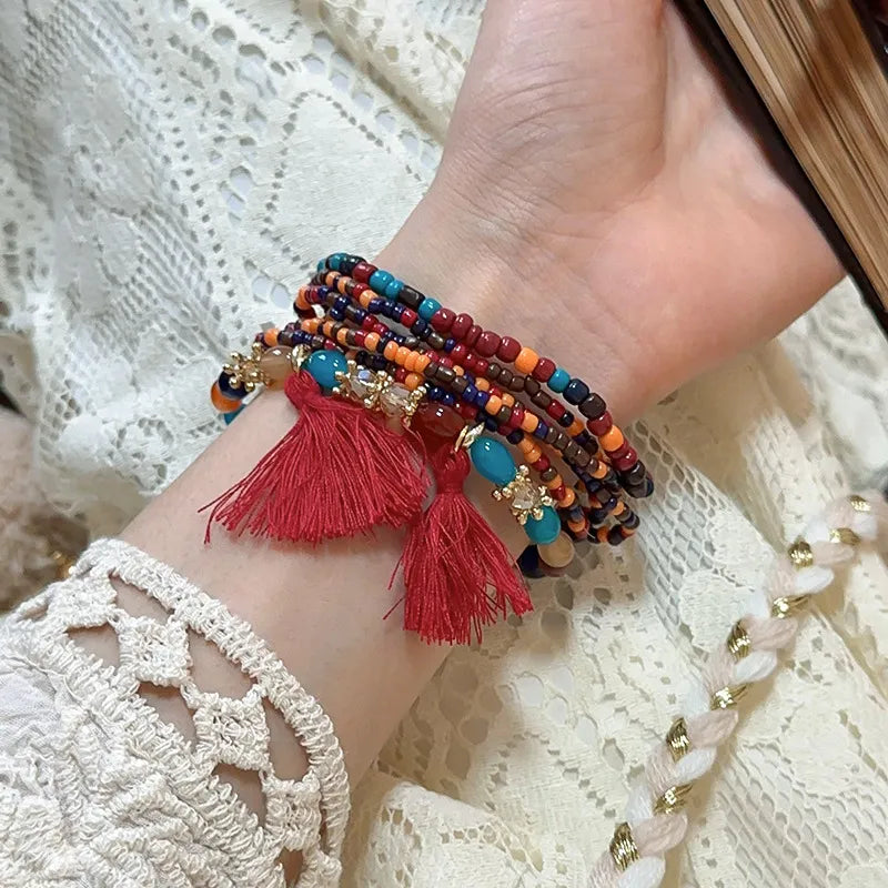Deep red rice bead bracelet with tassel accent – Whisper style from A Whimsical Affair.