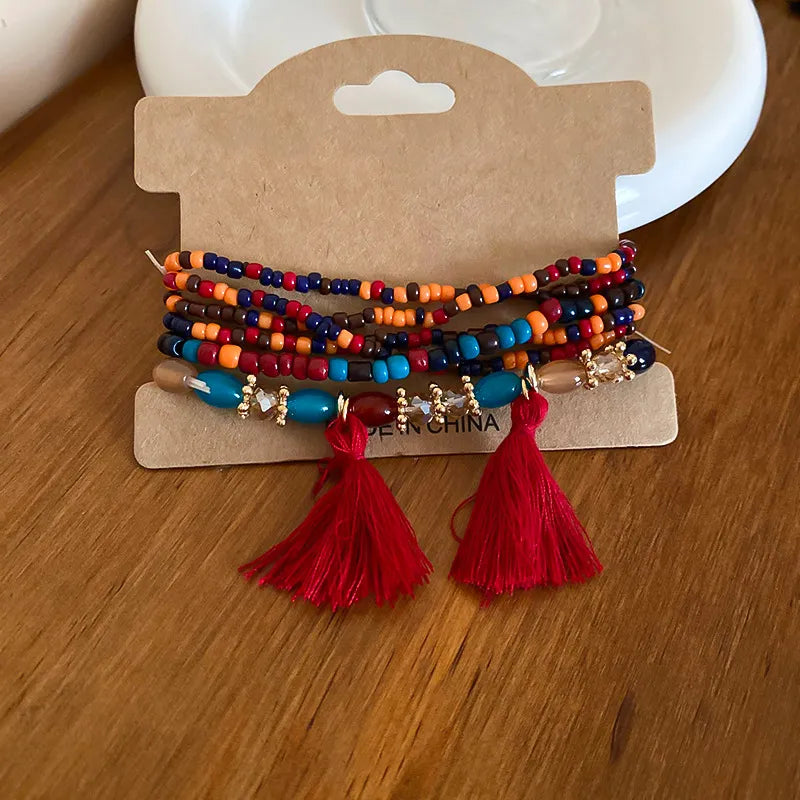 Deep red rice bead bracelet with tassel accent – Whisper style from A Whimsical Affair.