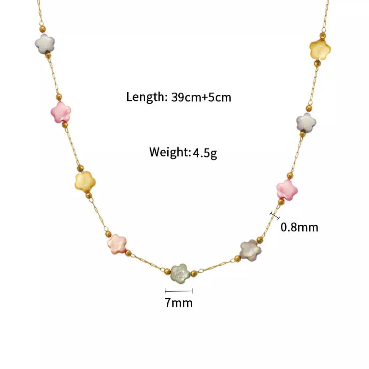 Delicate gold plated beaded chain necklace with soft resin beads displayed on a neutral fabric background
