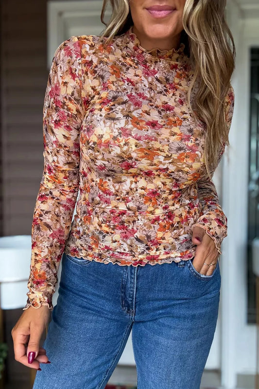 Sheer long sleeve floral top with warm autumn colors and ruffled edges.