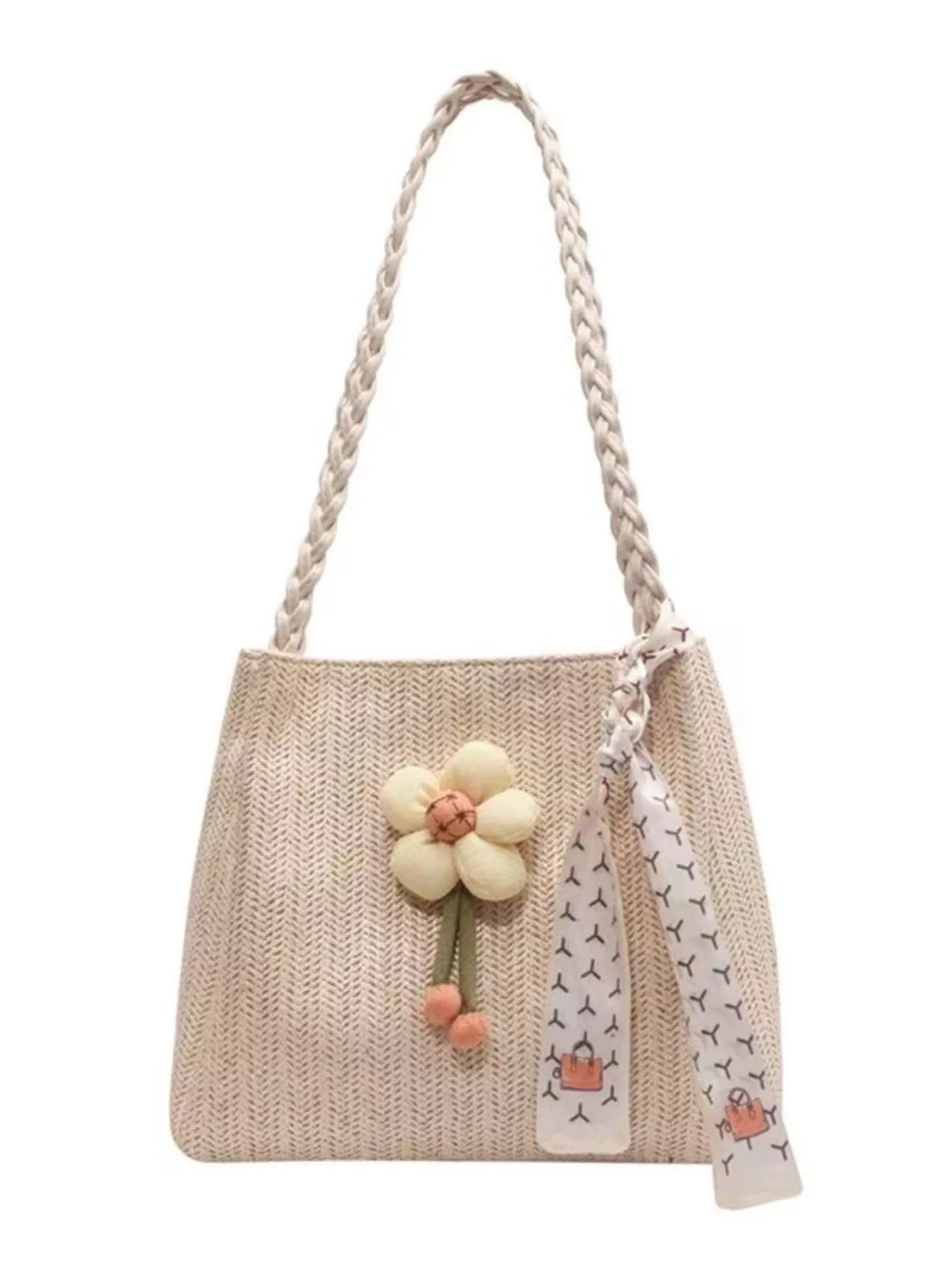 Beige woven straw tote bag with braided handles, a plush decorative flower, and a printed scarf detail