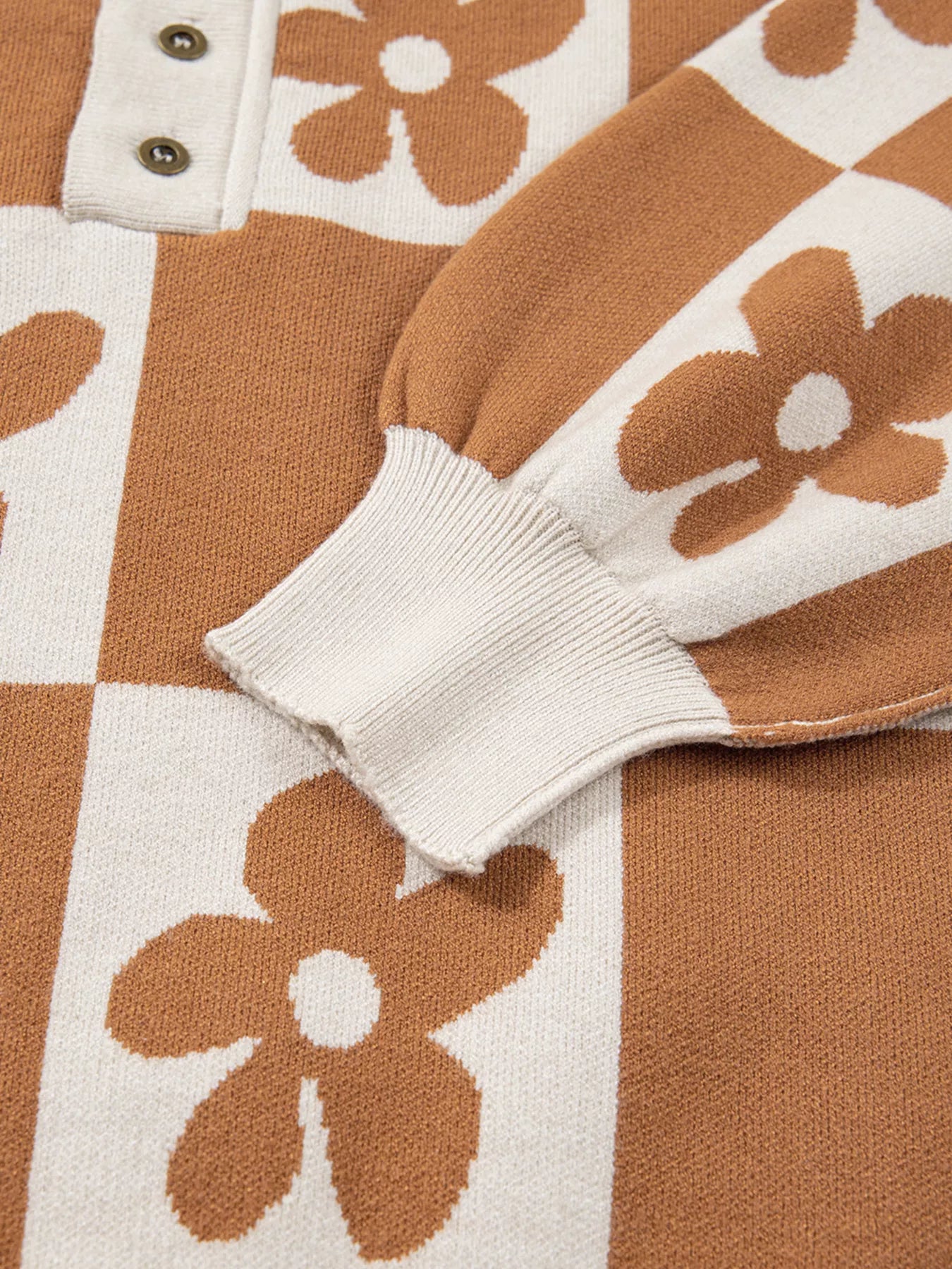Brown and cream checkerboard henley sweater with daisy floral pattern