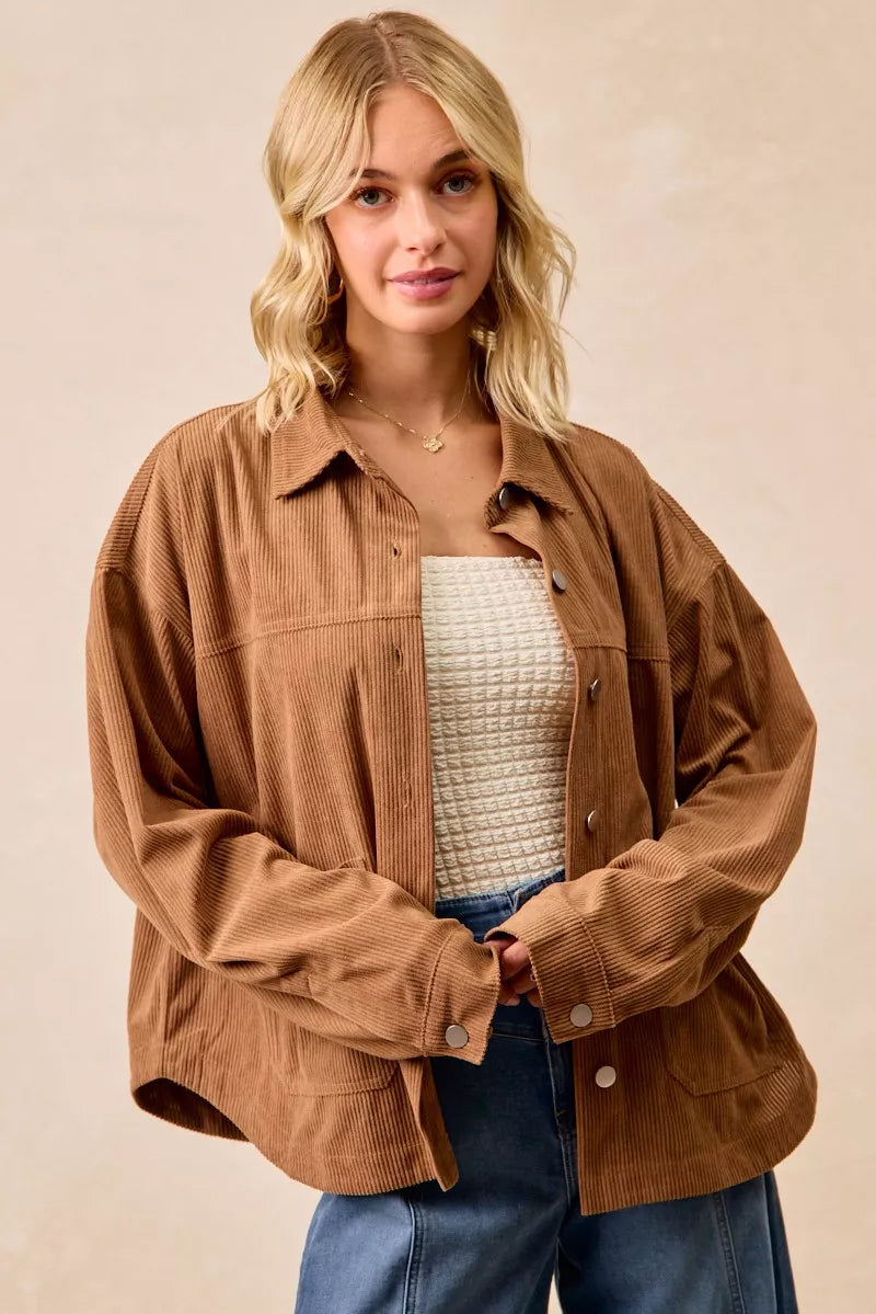Woman wearing a brown corduroy relaxed-fit shacket with front buttons
