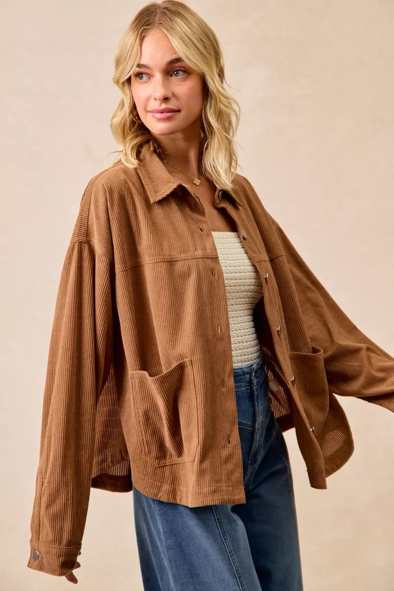 Woman wearing a brown corduroy relaxed-fit shacket with front buttons