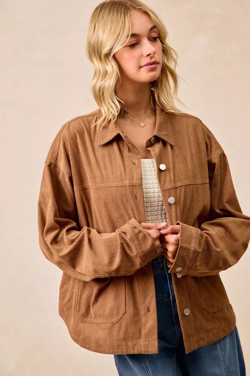 Woman wearing a brown corduroy relaxed-fit shacket with front buttons