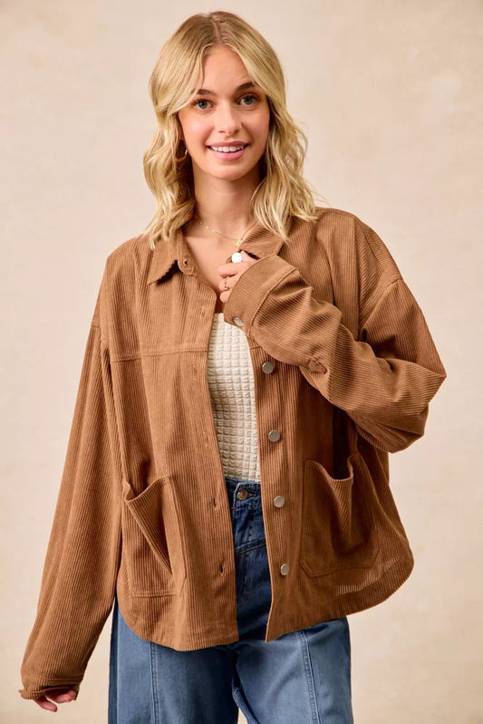 Woman wearing a brown corduroy relaxed-fit shacket with front buttons