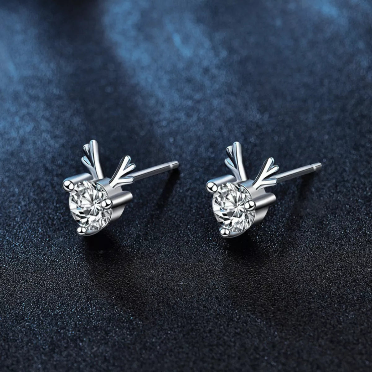 Sparkling reindeer antler earrings with round moissanite stones set in polished silver.
