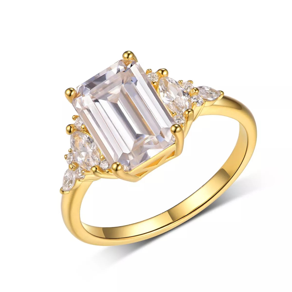 Close-up of emerald-cut moissanite ring with gold band and zircon accents — luxurious and elegant engagement ring from A Whimsical Affair.