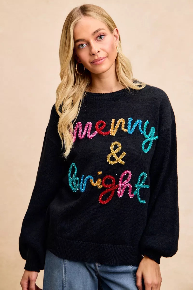 Festive tinsel lettering Christmas sweater in black with multicolor script