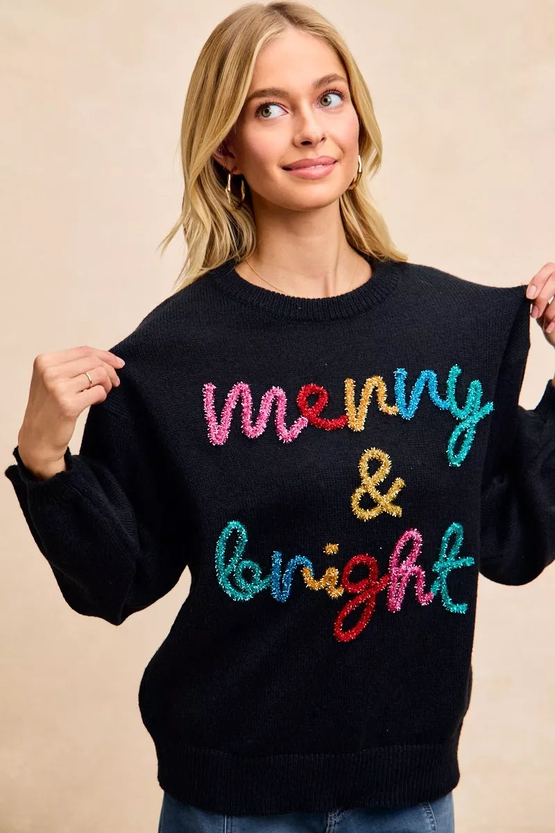 Festive tinsel lettering Christmas sweater in black with multicolor script