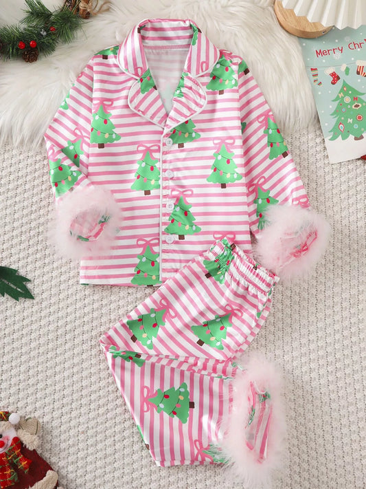 Kids pink Christmas pajama set with green tree print and pink feather trim on cuffs