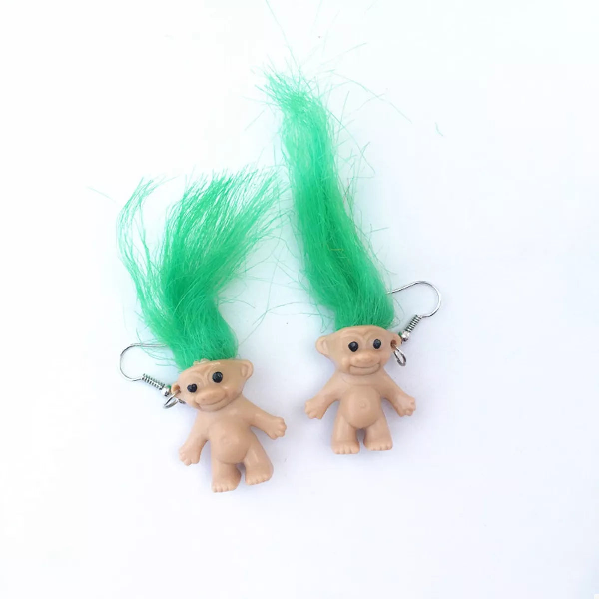 Vintage troll earrings with colorful hair and smiling doll design