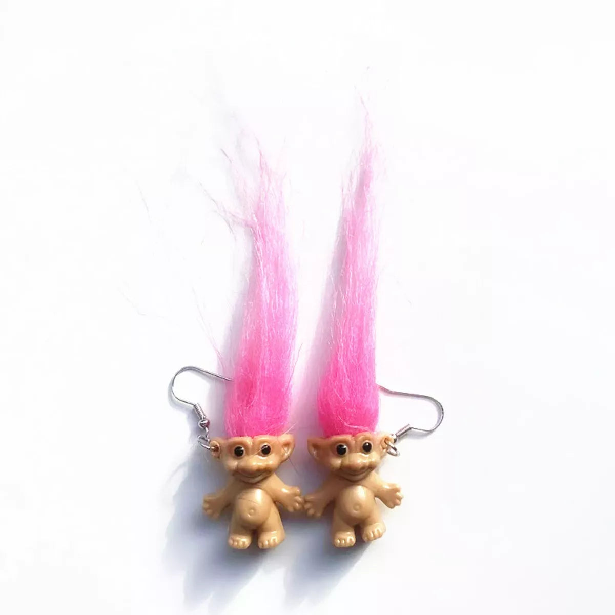 Vintage troll earrings with colorful hair and smiling doll design