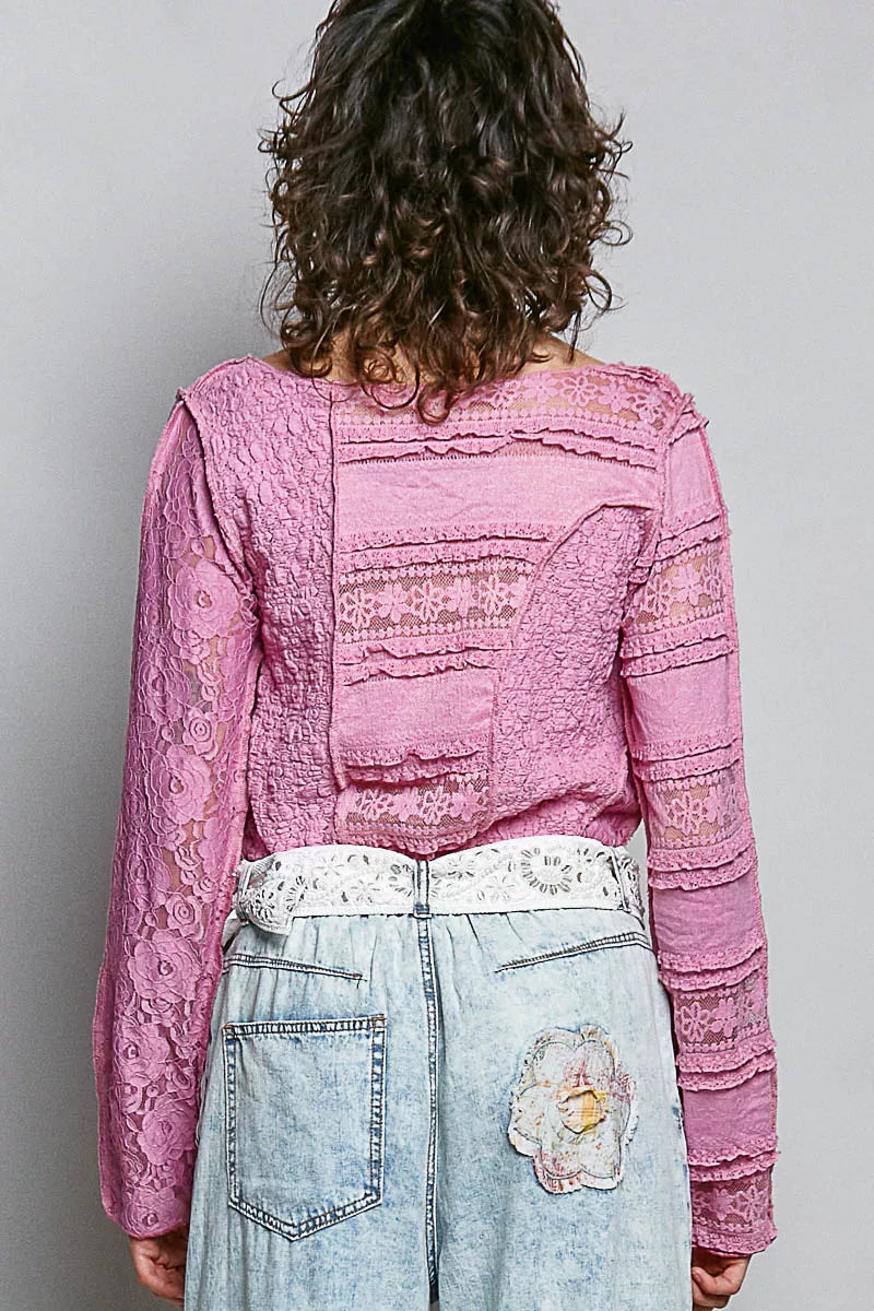 Pink lace long sleeve slim-fit top with patch detailing and high-low hem styled with light wash denim